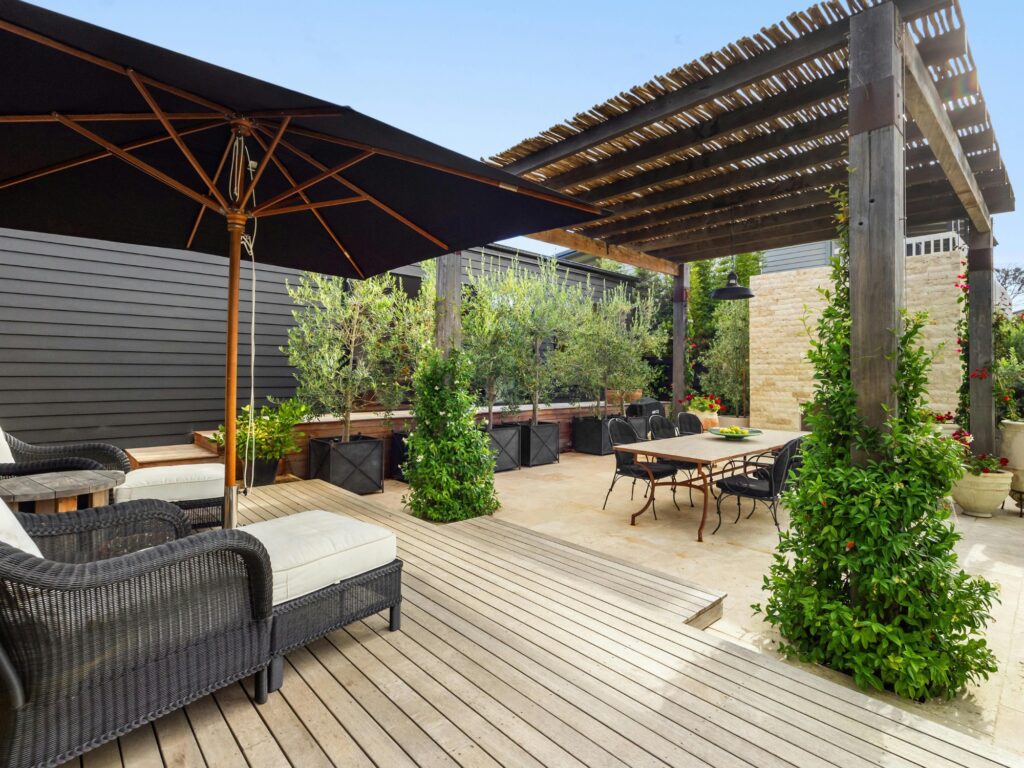 Professional applying deck refinishing stain