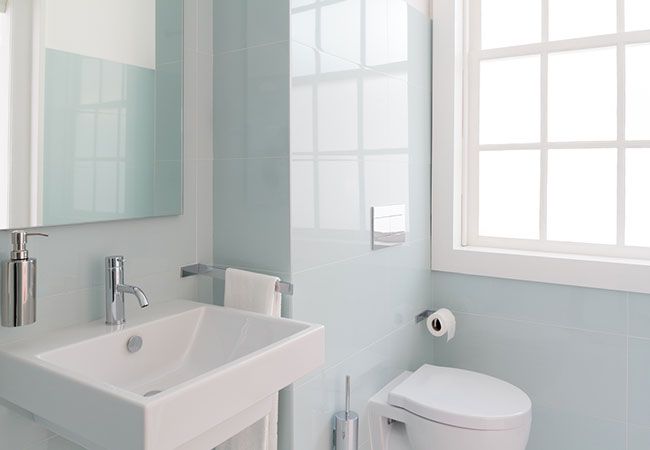 Licensed plumber installing bathroom fixtures