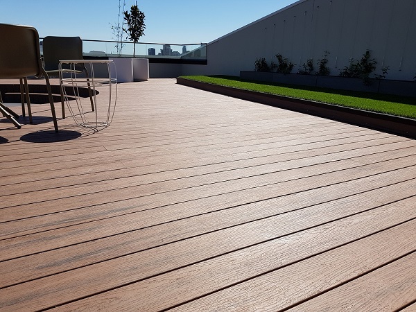 Low maintenance composite deck boards