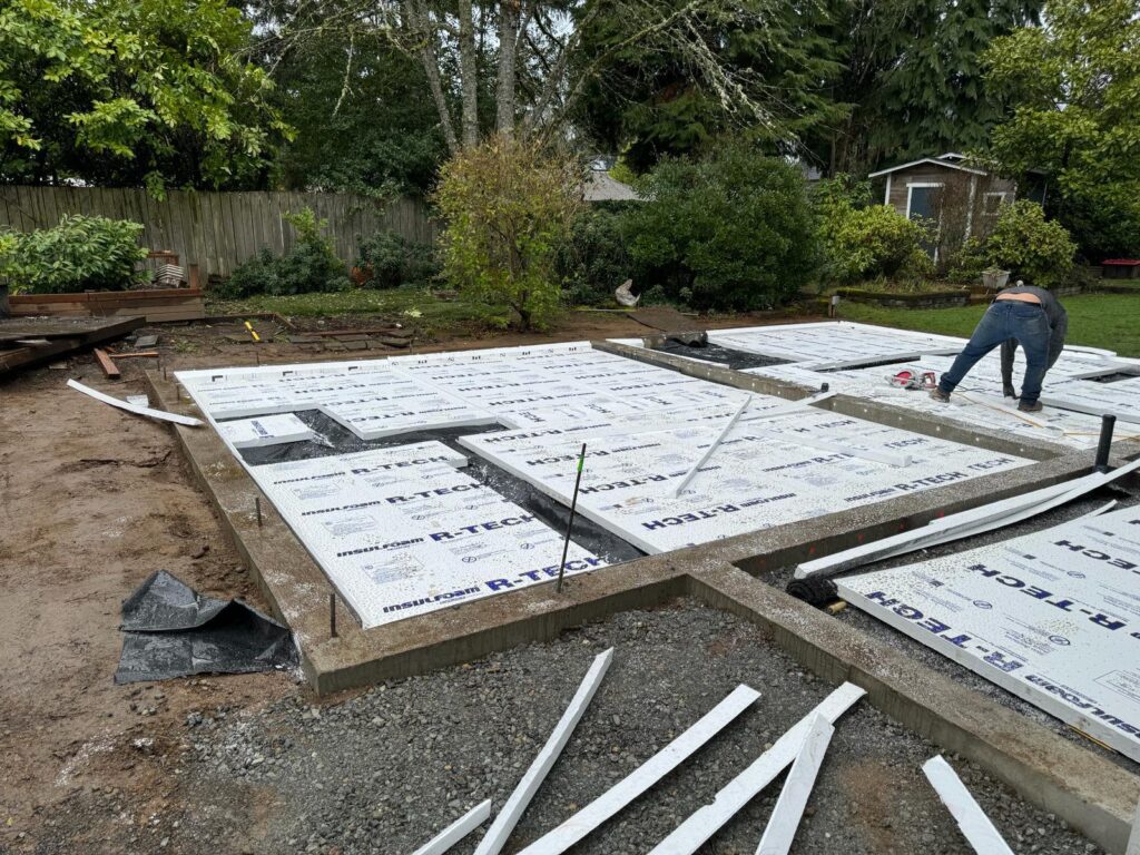 Construction crew pouring residential foundation